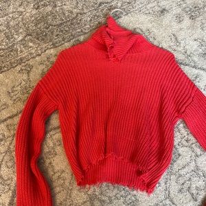 Ripped detailed cropped turtle neck sweater